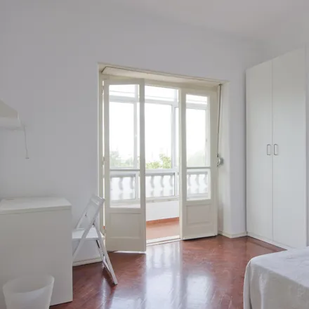 Rent this 3 bed room on Rua Ramalho Ortigão 45 in 1070-230 Lisbon, Portugal