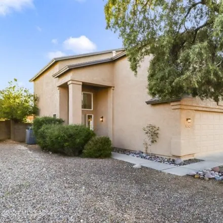 Buy this 4 bed house on 9042 East Orchid Vine Drive in Tucson, AZ 85747