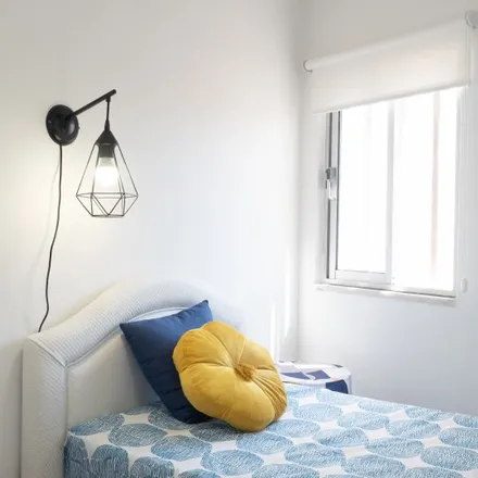 Rent this 4 bed room on Rua Elias Garcia in 2700-598 Mina de Água, Portugal