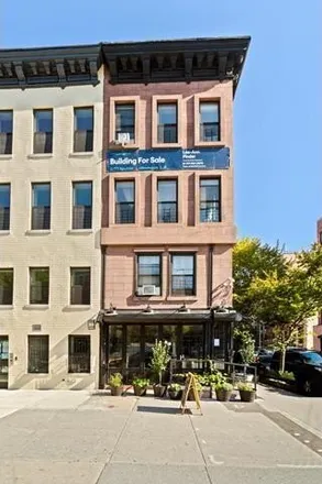 Buy this 4 bed townhouse on 422 Malcolm X Boulevard in New York, NY 10037