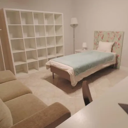 Rent this 4 bed room on Rua João Pereira da Rosa in 2765-465 Cascais, Portugal
