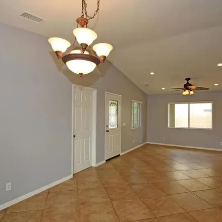 Rent this 4 bed apartment on Reclinata Way in Indio, CA 92203