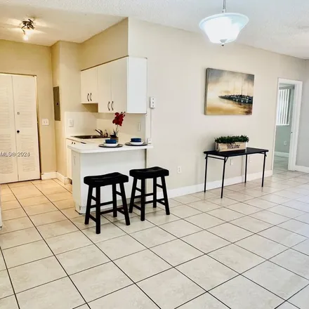 Rent this 2 bed apartment on 3207 Sabal Palm Manor in Davie, FL 33024