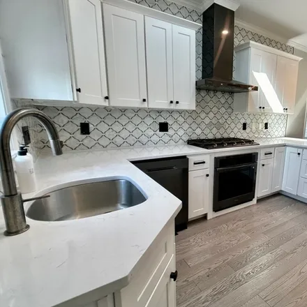 Rent this 3 bed condo on 222 Roslindale Ave