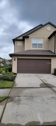 Rent this 3 bed townhouse on 773 Artisan street in Orange County, FL 32824