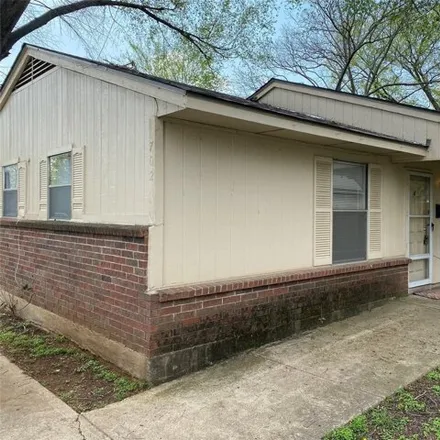 Rent this 2 bed house on 696 North Pecan Street in Arlington, TX 76011