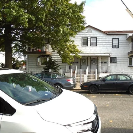 Buy this 4 bed townhouse on 8 Cyrus Avenue in New York, NY 11229
