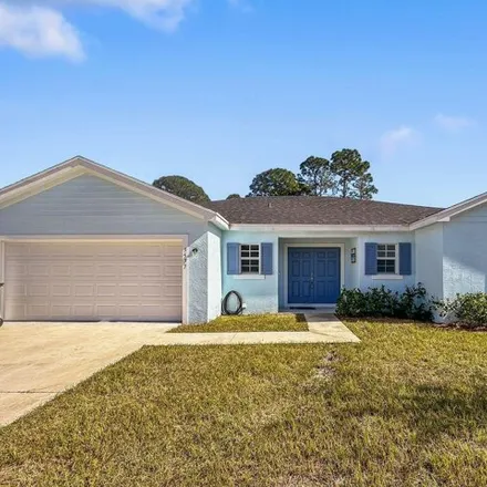 Rent this 3 bed house on 3541 Southwest Vollmer Street in Port Saint Lucie, FL 34953