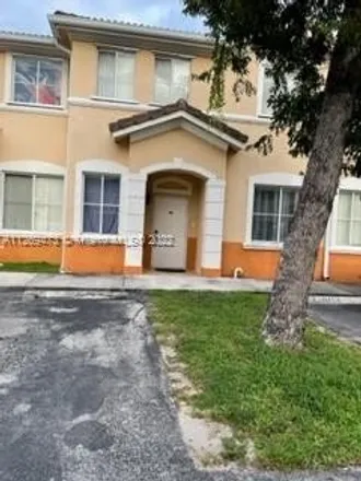 Buy this 4 bed townhouse on 401 West 49th Street in Palm Springs, Hialeah