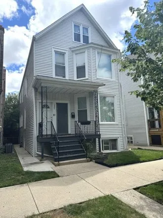 Rent this 3 bed house on 3223 N Ridgeway Ave Unit 1 in Chicago, Illinois