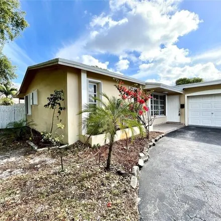 Rent this 3 bed house on 8595 Sheraton Drive in Miramar, FL 33025