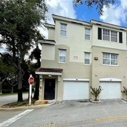 Rent this 3 bed townhouse on Garrett Academy in West Sample Road, Coral Springs