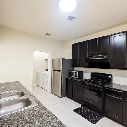 Rent this 4 bed apartment on 7245 Autumn Sun Drive in Harris County, TX 77083