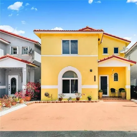 Buy this 3 bed townhouse on West 72nd Place in Hialeah, FL 33016