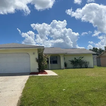 Rent this 3 bed house on 706 Maderia Court in Poinciana, FL 34758
