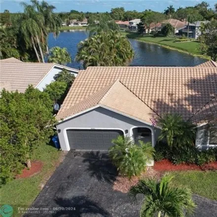 Buy this 4 bed house on 5041 NW 64th Dr in Coral Springs, Florida