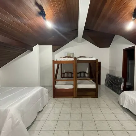 Rent this 6 bed house on Bertioga in Região Metropolitana da Baixada Santista, Brazil