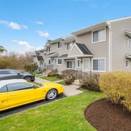 Buy this 2 bed townhouse on 302 Covington Green Lane in Patterson, NY 12563