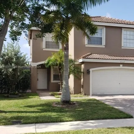 Rent this 4 bed house on 4027 Cresent Creek Street in Coconut Creek, FL 33073