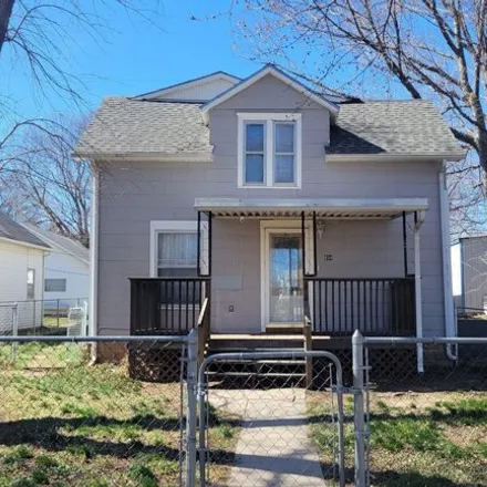 Buy this 4 bed house on 840 South C Street in Wellington, KS 67152