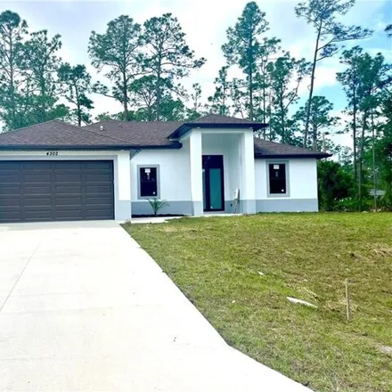 Buy this 4 bed house on 4298 East 9th Street in Lehigh Acres, FL 33972