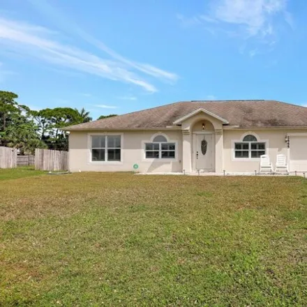 Buy this 4 bed house on 2443 Southwest Falcon Circle in Port Saint Lucie, FL 34953