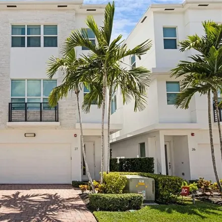 Buy this 3 bed townhouse on 2900 Northeast 12th Terrace in Coral Woods, Broward County