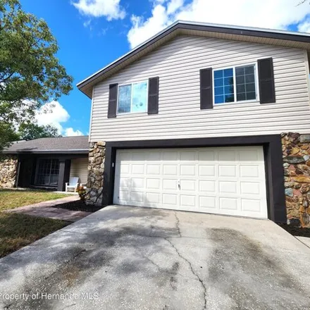 Buy this 4 bed house on 12555 Stagecoach Lane in Bayonet Point, FL 34667