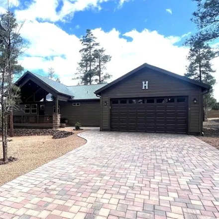 Buy this 2 bed house on 100 North Retreat Way in Show Low, AZ 85901