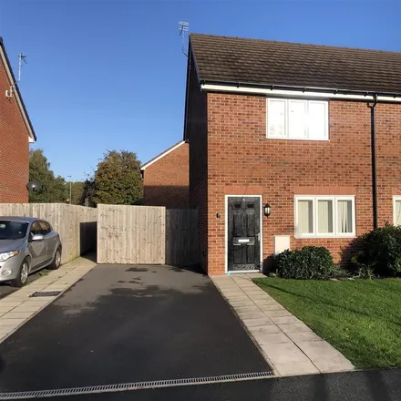 Rent this 2 bed townhouse on 15 Greenfinch Grove in Oakwood, Warrington