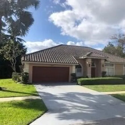 Buy this 4 bed house on 1711 Wiltshire Village Drive in Wellington, FL 33414