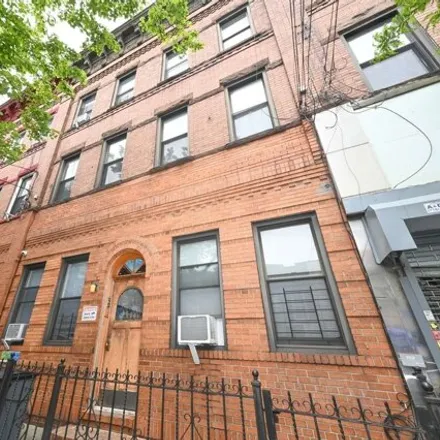Buy this 6 bed house on 561 Woodward Avenue in New York, NY 11385