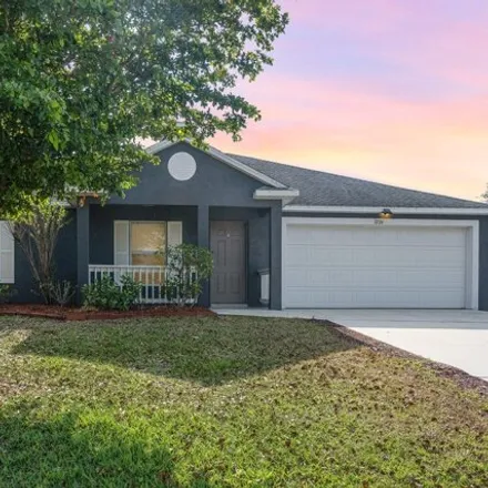 Buy this 3 bed house on 3226 Toronto Avenue Southeast in Palm Bay, FL 32909