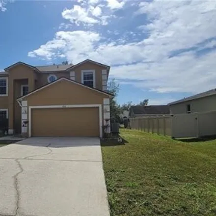 Rent this 4 bed house on 422 Gannet Court in Polk County, FL 34759