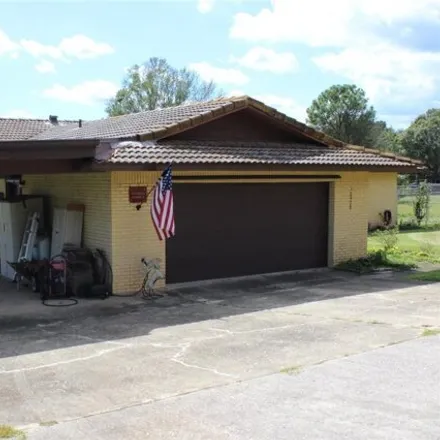 Rent this 3 bed house on 10928 Evmar Drive in Lake County, FL 34711