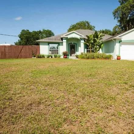 Rent this 4 bed house on 7133 Carlowe Avenue in Port Saint John, Brevard County