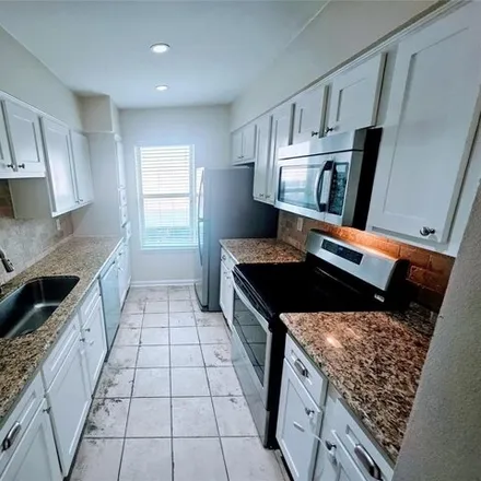 Rent this 2 bed condo on Candlewood Lane in Houston, TX 77057