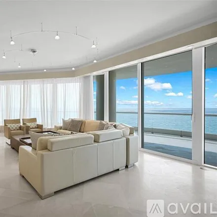Rent this 4 bed condo on 16047 Collins Ave