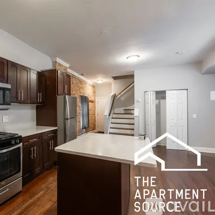 Rent this 3 bed apartment on 3143 W Warren Blvd