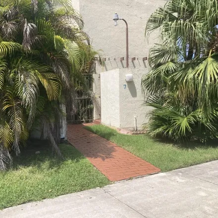 Rent this 2 bed townhouse on 7-Eleven in 1 West Flagler Street, Miami