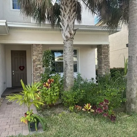 Buy this 4 bed house on 1304 Northwest Leonard Circle in Port Saint Lucie, FL 34986
