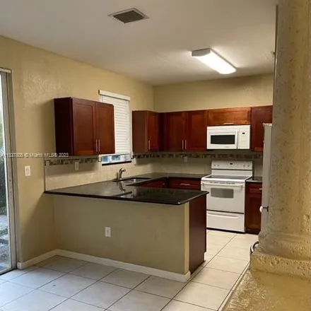 Rent this 3 bed apartment on 6980 Northwest 177th Street in Miami-Dade County, FL 33015