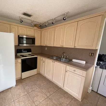 Rent this 3 bed condo on 3502 SW 24 ST