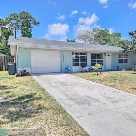 Buy this 4 bed house on 6091 Tangelo Drive in Indian River Estates, Saint Lucie County