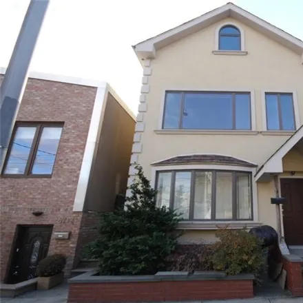 Buy this 3 bed house on 67-10 53rd Drive in New York, NY 11378