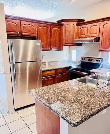 Rent this 4 bed house on 6780 NW 69th Ct in Tamarac, Florida