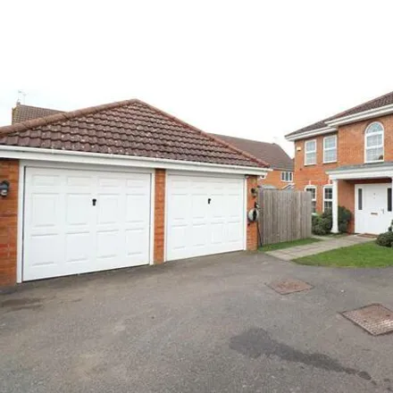 Rent this 4 bed house on Comfrey Close in Rushden, NN10 0GL