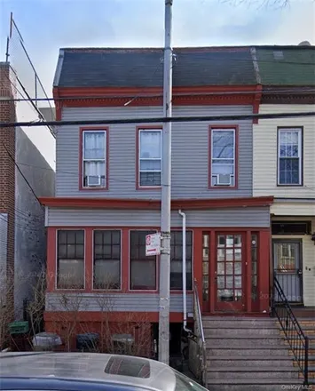 Buy this 8 bed townhouse on 1326 Findlay Avenue in New York, NY 10456