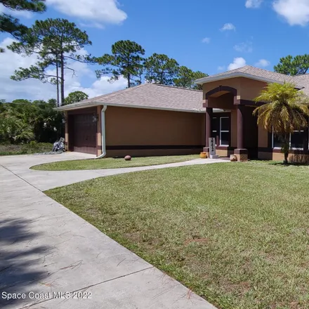 Buy this 5 bed house on 2772 Tolman Avenue Southeast in Palm Bay, FL 32909