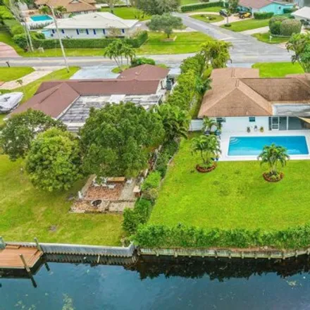 Buy this 3 bed house on 7969 West Lake Drive in Lake Clarke Shores, Palm Beach County